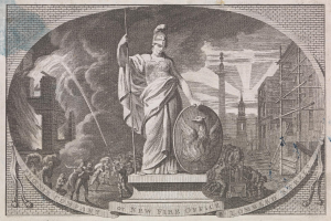 Bronze Statue of Liberty holding a torch and tablet, surrounded by a crowd with buildings and utility poles in the background, under a sky with text at the bottom.
