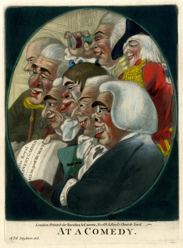 Eine Gruppe von Menschen in einem Kreis, die zusammen über einen Witz lachen, mit einer Person, die ein Blatt Papier hält.