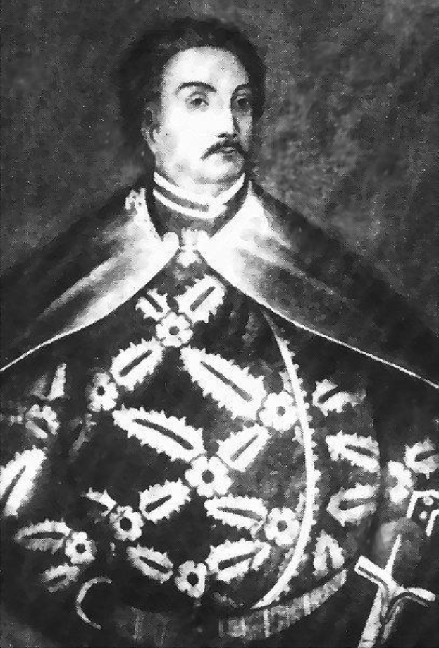 Schwarzes und weißes Foto von Papst Johannes Paul II. in Priesterrobe, der eine schwarze Robe mit weißem Kragen und Manschetten trägt und die Hände falt, strenger Gesichtsausdruck, direkter Blick.