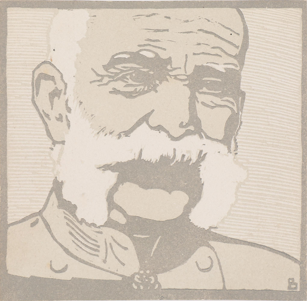 Alter Mann mit weißem Bart und Schnurrbart, der einen Anzug und eine Krawatte trägt und seine Hände vor sich verschränkt, direkt in die Kamera schaut.